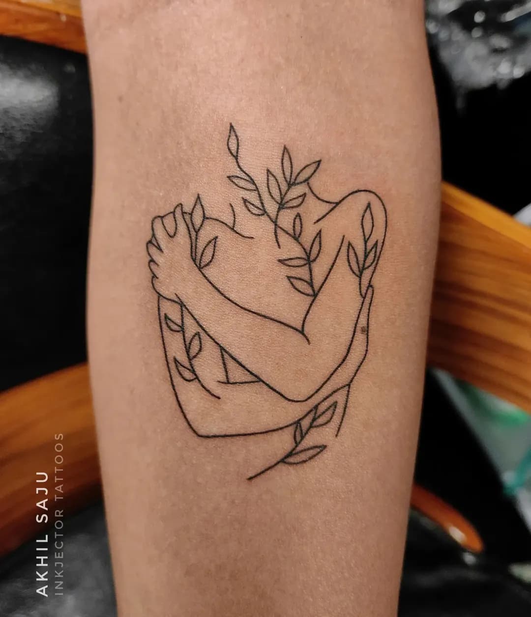 Botanical Self-Hug - Custom Tattoo Art at Inkjector Tattoos Kozhikode Kerala